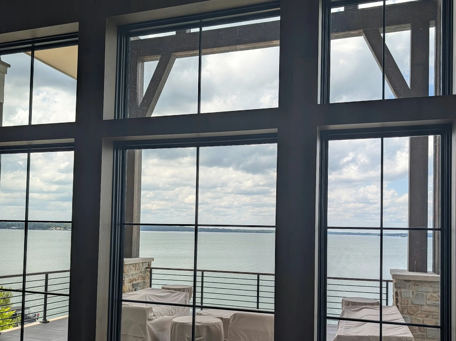 Lake view through large windows at a ProLine lake-home installation